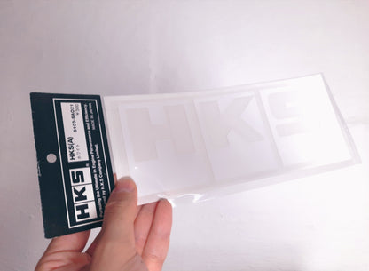 Details of the original HKS white logo sticker in the original package
